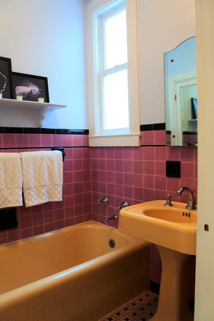 Vintage oxblood and peach bathroom in a District 2 home.