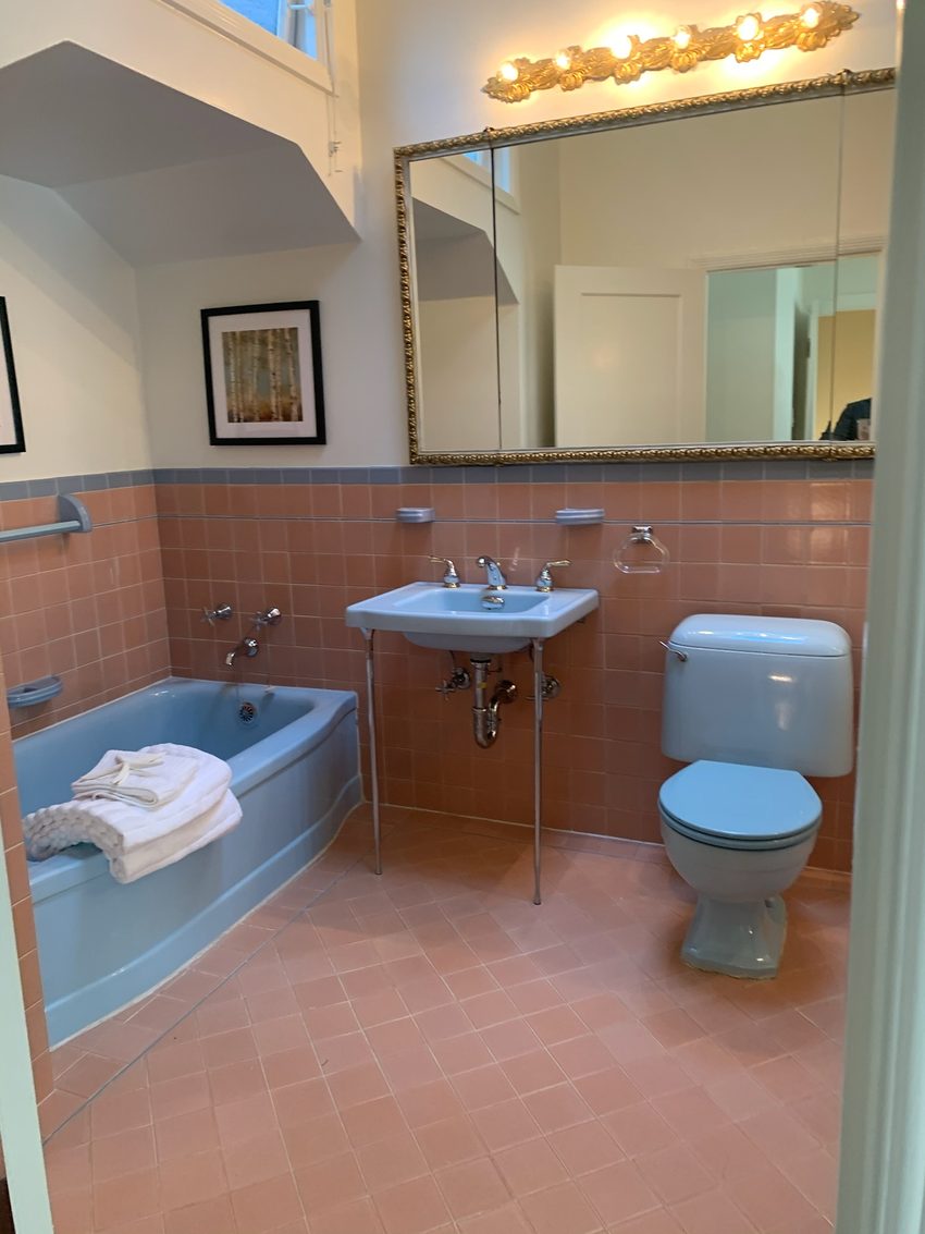 Vintage salmon and powder blue bathroom in a District 2 home.