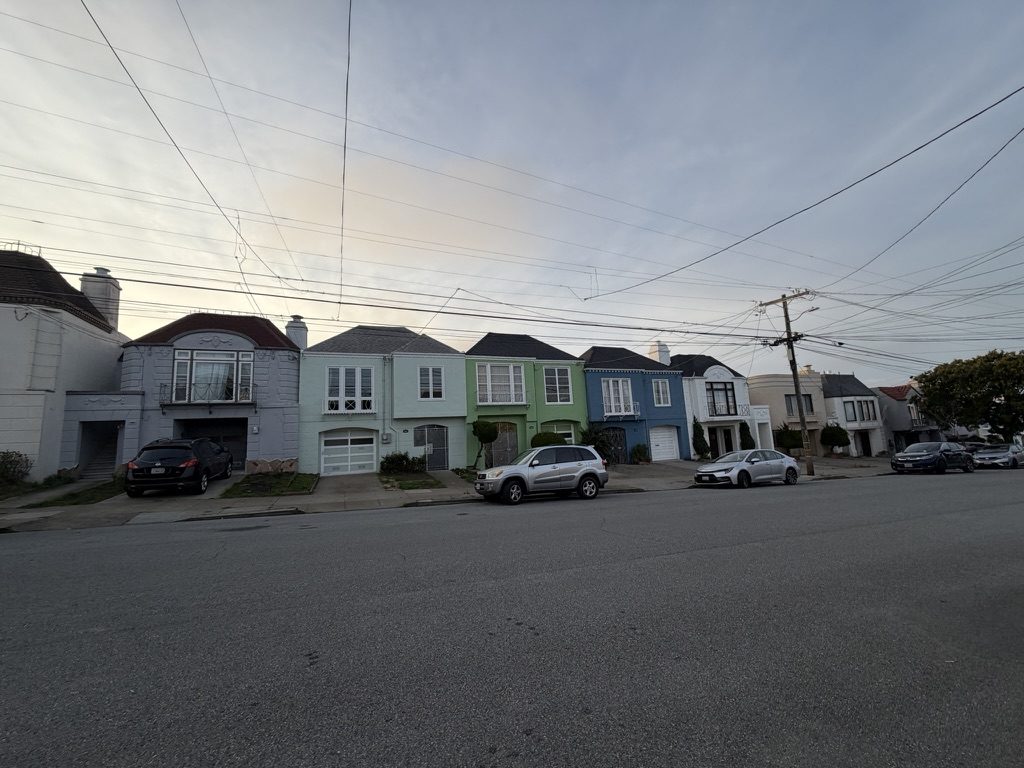 District 2 houses showing variations in exterior condition and window updates.