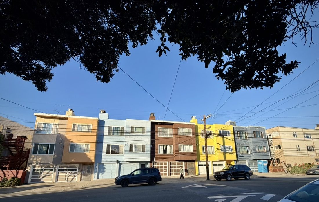 District 2 homes showing added upper-story expansions.