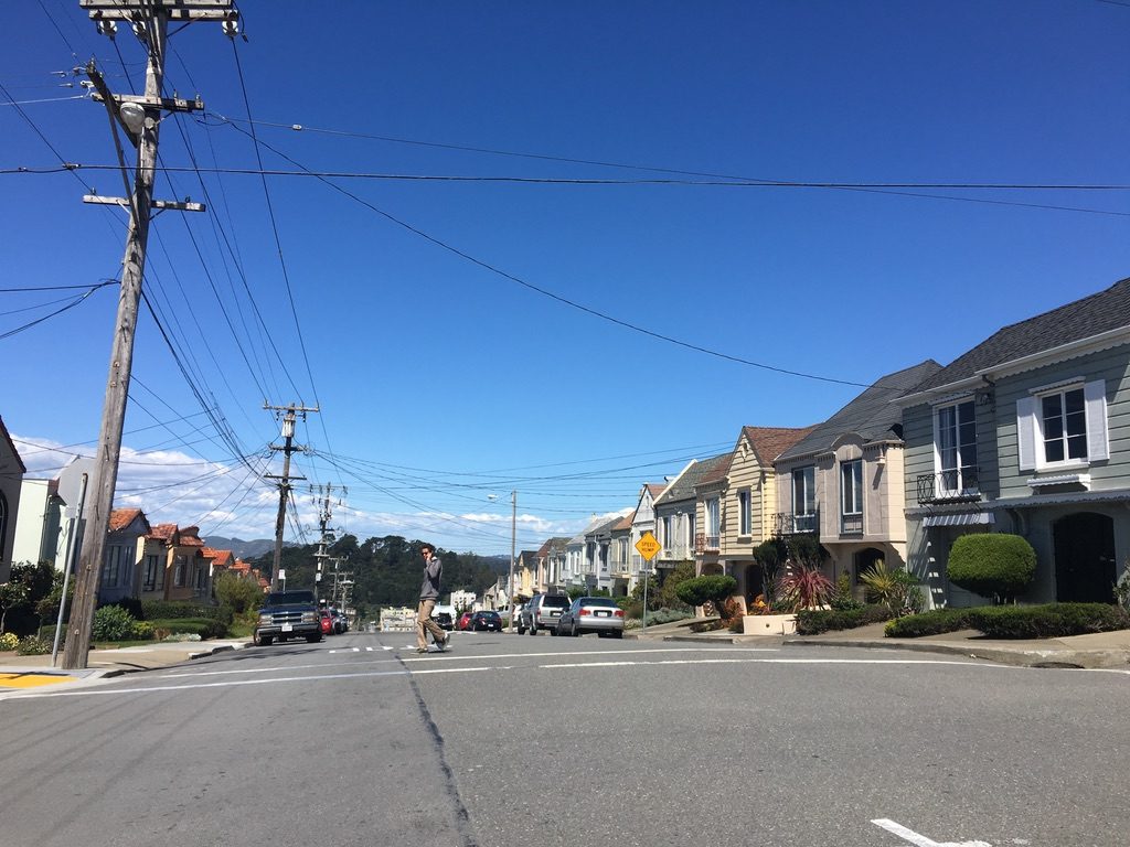 Typical District 2 houses with garages at street level and living space above.