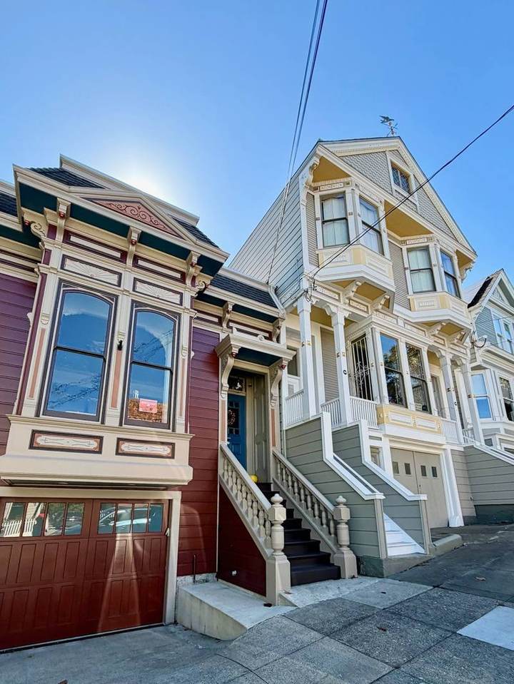 Oxblood Italianate next to a Queen Anne